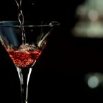 HD1080p: Super Slow Motion shot of pouring red martini into the glass.